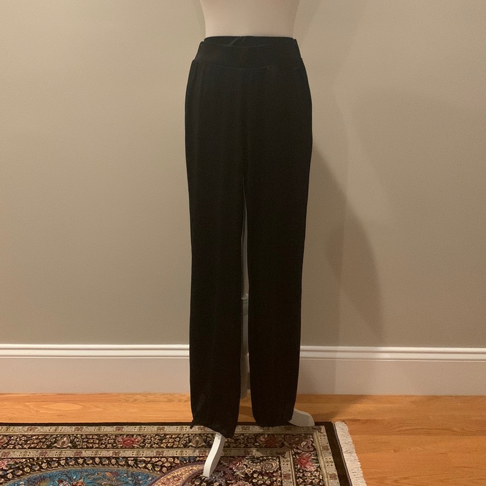 Demix track pants. Size 42-44 (US 8-10, M).